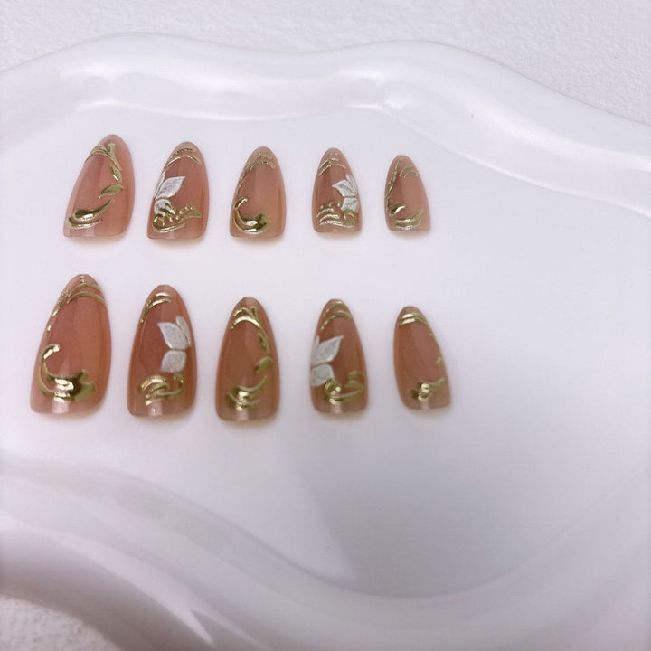 Elegant artificial nails with marble and gold accents Stornfield