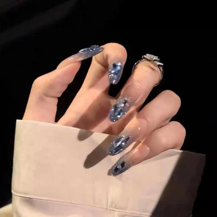 Artificial nails in creative moon and star design Stornfield