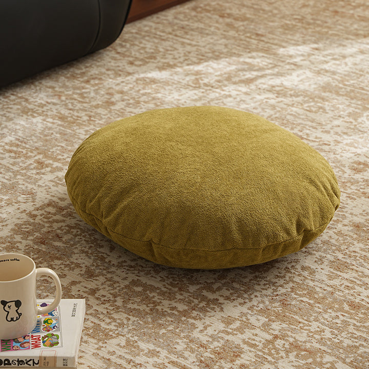 Round floor seat pouf made of teddy plush with a shape-retaining padded core Stornfield