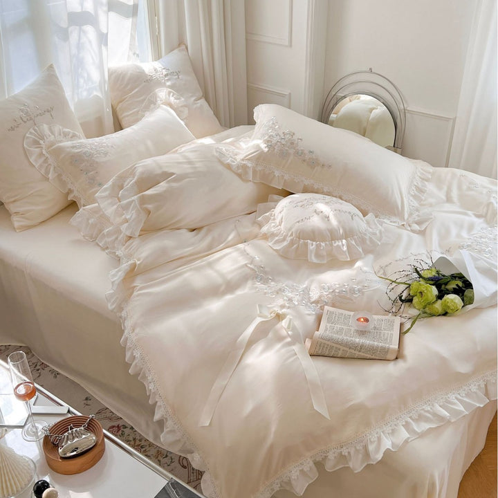 Romantic cotton satin bedding set with ruffles, floral embroidery, and satin bows