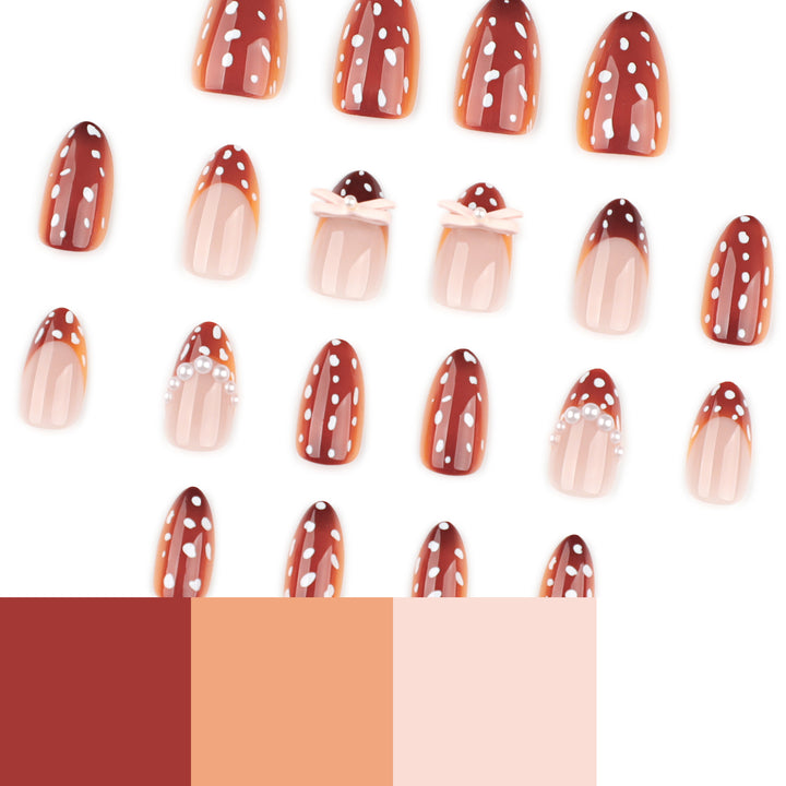 Artificial nail art with dot pattern and bow accents Stornfield