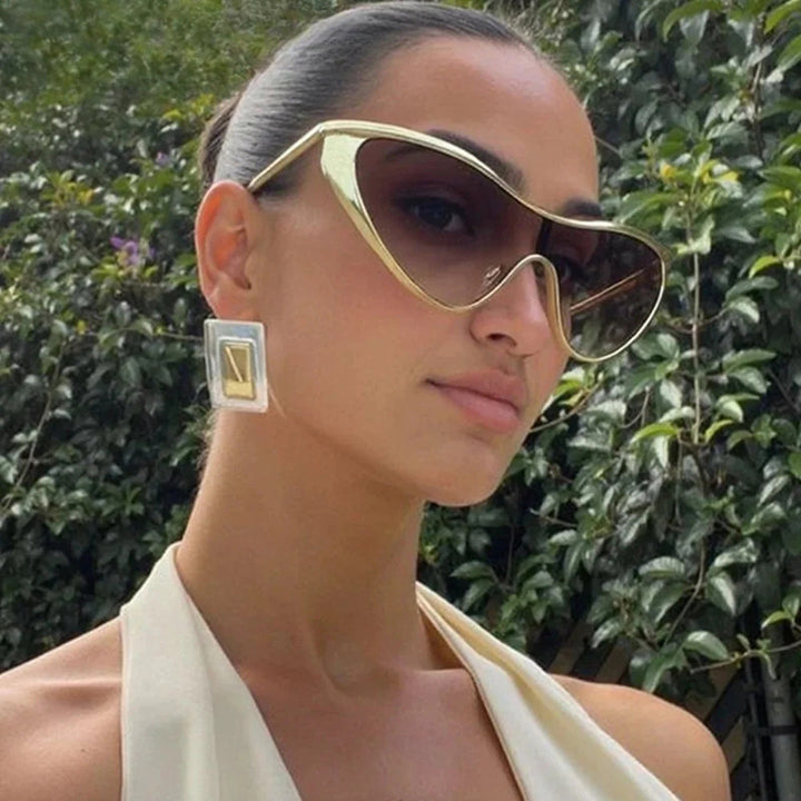 Ladies extravagant shaped sunglasses with protective UV filter Stornfield