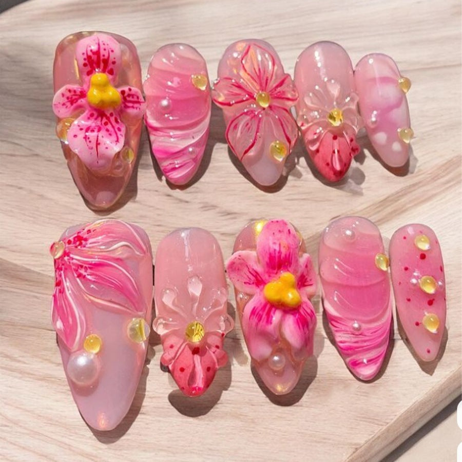 Artificial nail set with floral designs and sparkling accents Stornfield