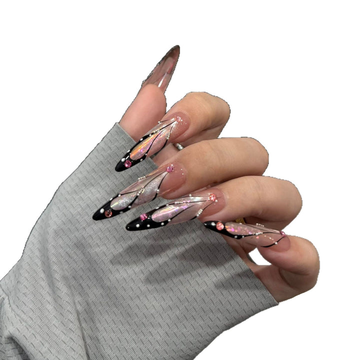 Artifical nail tips with elegant designs and glitter accents Stornfield