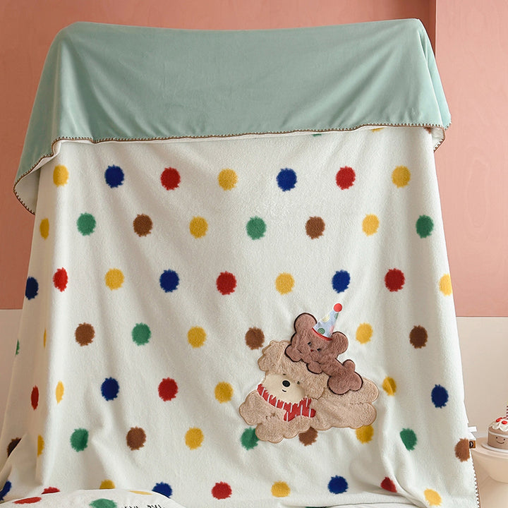 Plaid blanket checkered with appliqued animal motifs and soft velour lining
