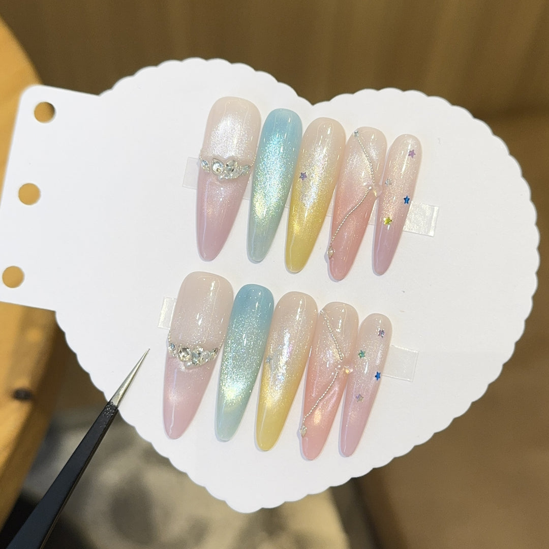 Artificial nails with shimmering effects and sparkling rhinestone details Stornfield
