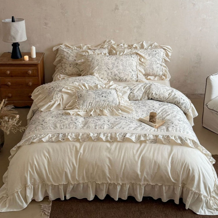 Romantic bedding set with ruffles, floral jacquard application and decorative cushions