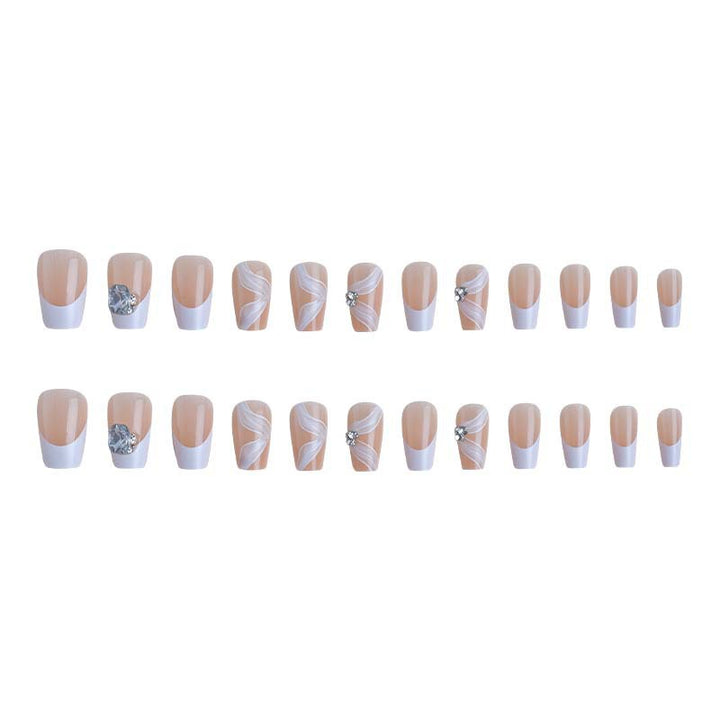 Elegant artificial nail set with delicate decorations and glitter elements Stornfield