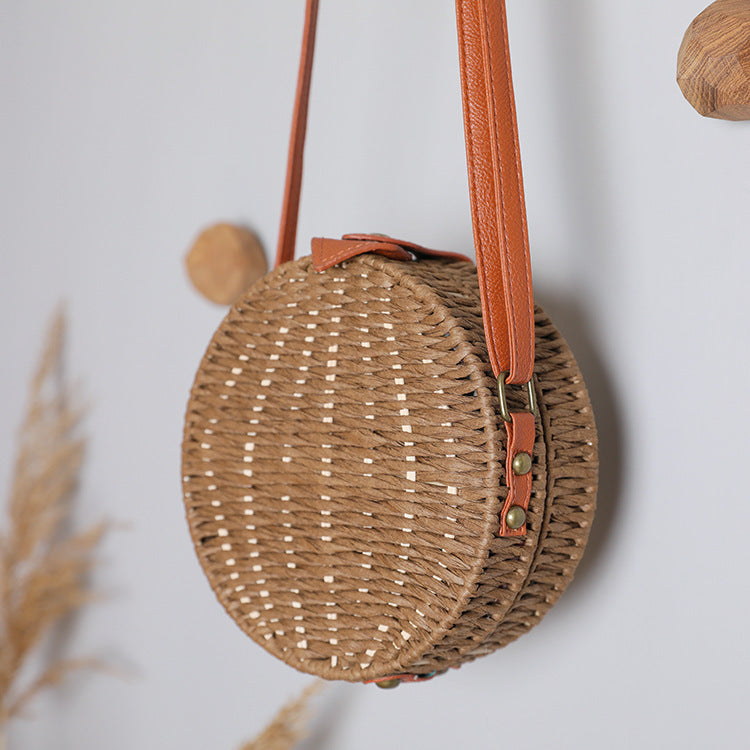 Round basket bag with leather accents Stornfield