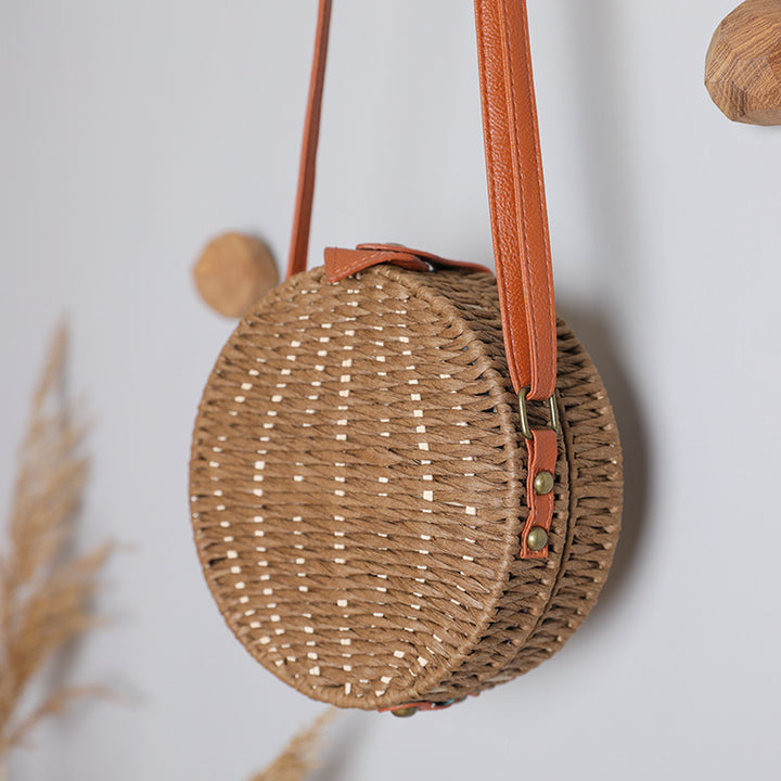 Round basket bag with leather accents Stornfield