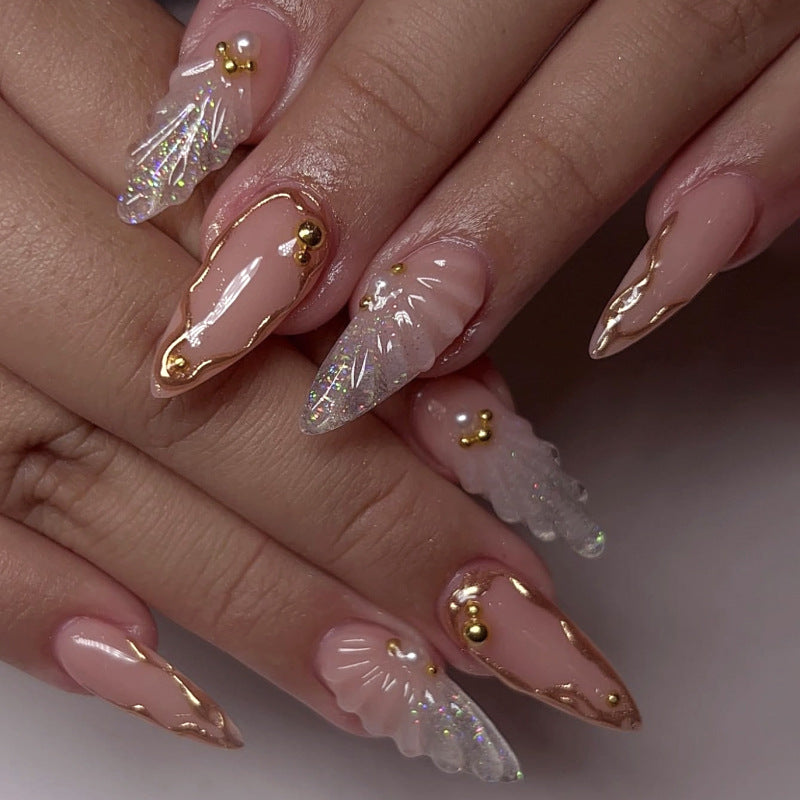 Artful stiletto nails with elegant gold embellishment design Stornfield