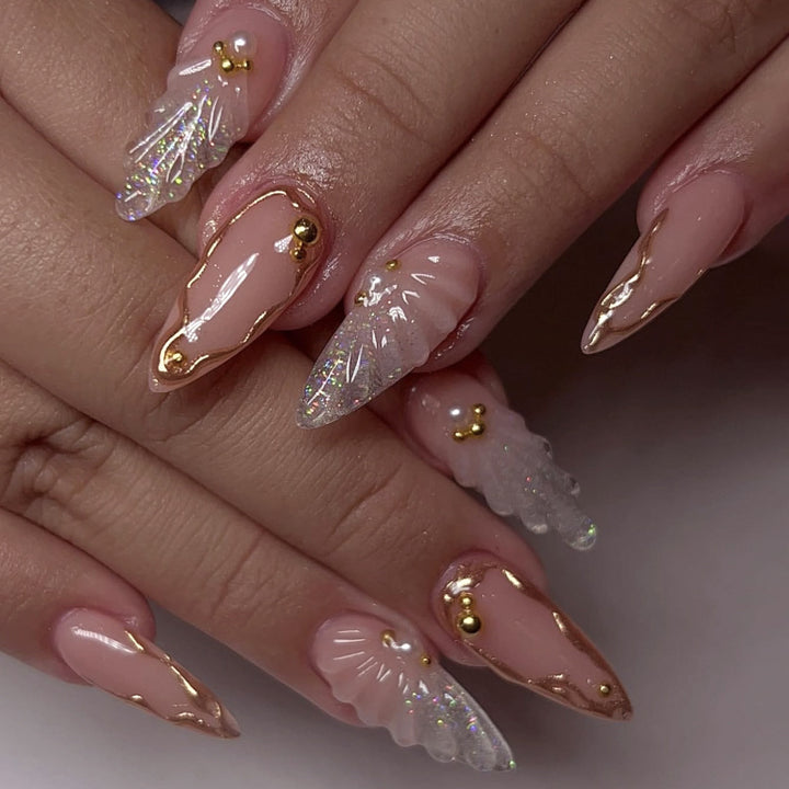 Artful stiletto nails with elegant gold embellishment design Stornfield