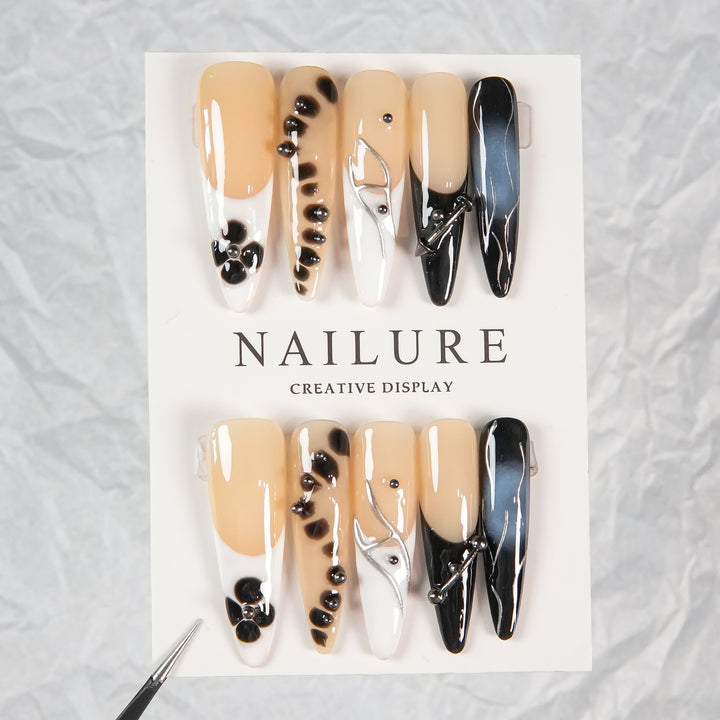 Artistic Stiletto Press-On Nails with Unique Patterning