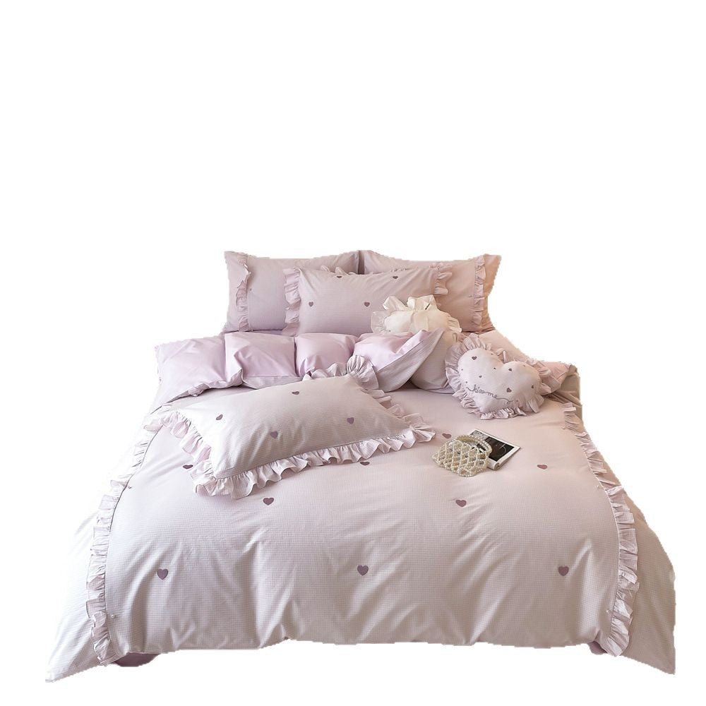 Romantic bedding set made of cotton satin with ruffles and heart print