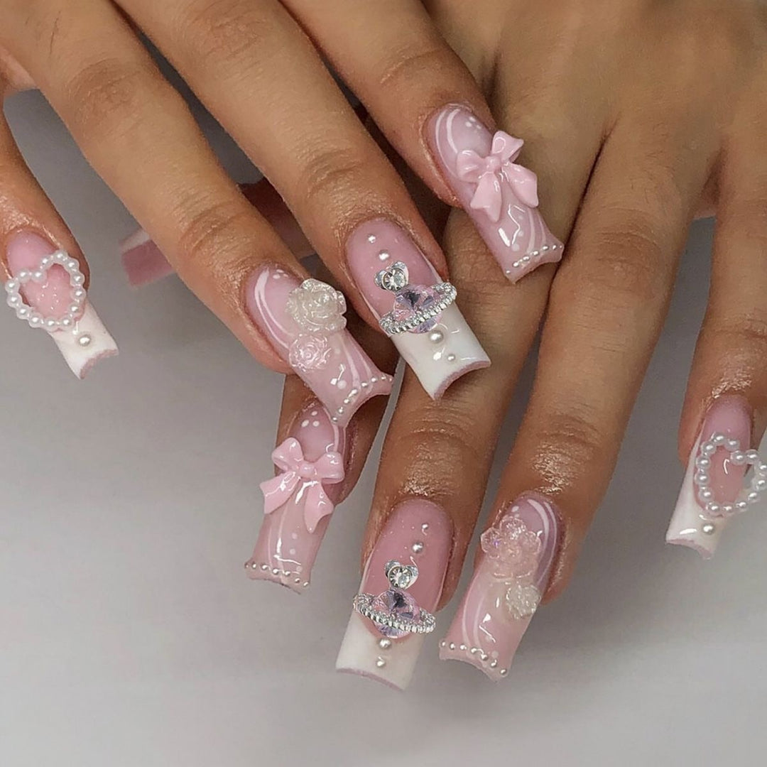Creative acrylic nail set with delicate pearl and gloss accents Stornfield