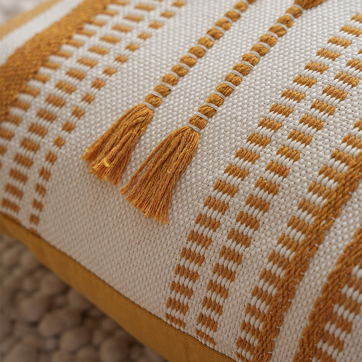 Structured square decorative pillow with crocheted trim and striped knit texture