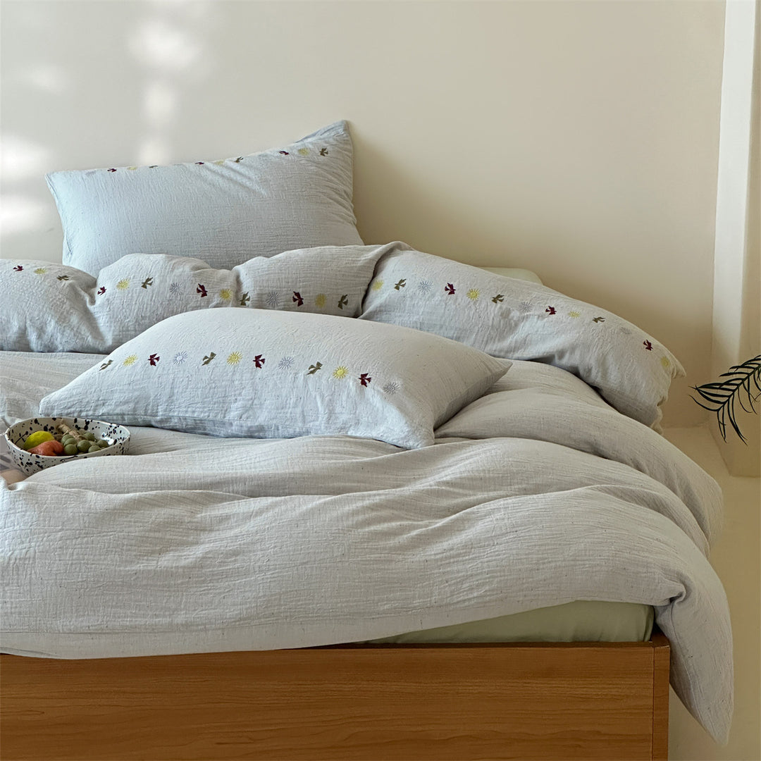 Bedding set in linen look with subtle embroidered border