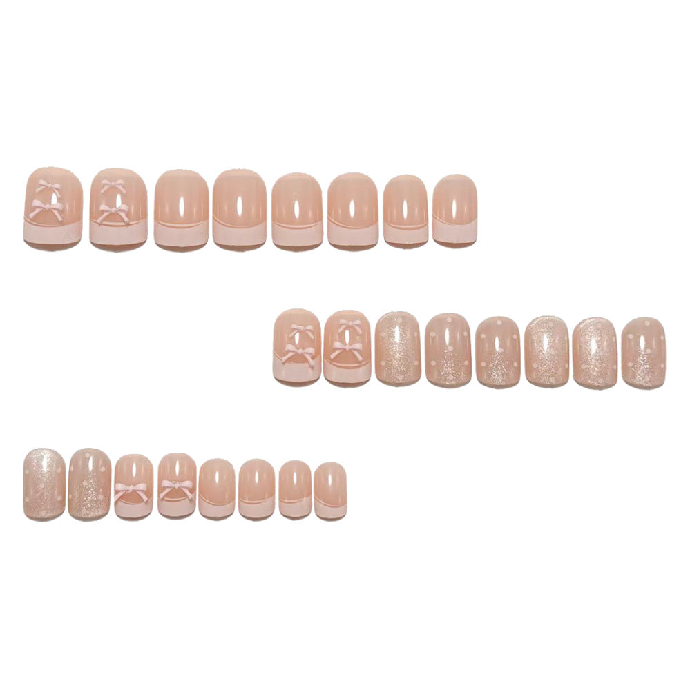 Artificial nails with delicate bows and glitter accents Stornfield