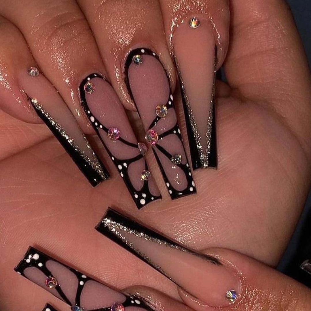 Artful stiletto artificial nails with glitter and butterfly motif Stornfield