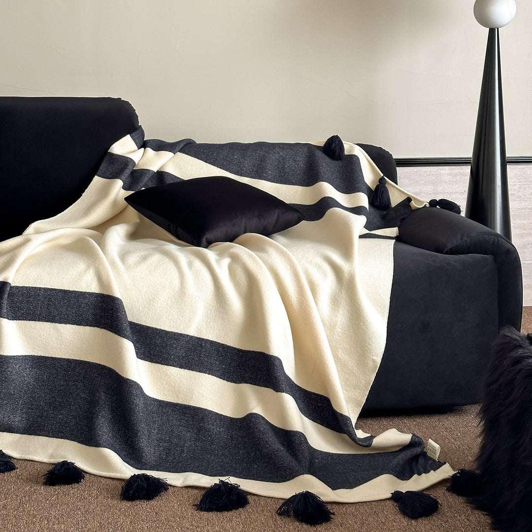Soft woven blanket with tassels and diagonal stripes