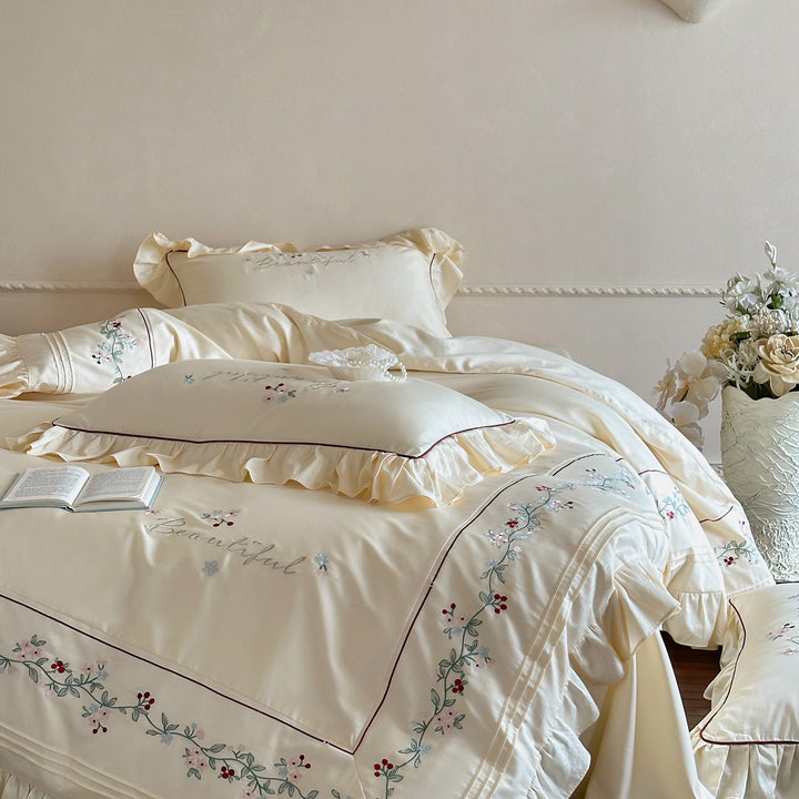 Luxurious bedding set with ruffled hem and floral embroidery