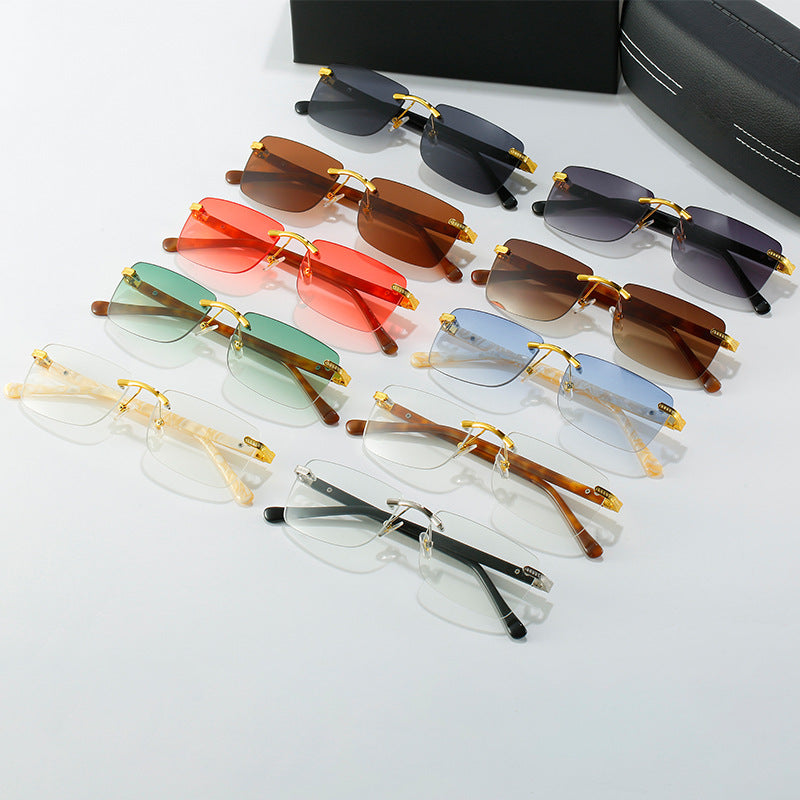 Women's fashionable sunglasses with a stylish, rectangular frame and elegant metal accents Stornfield