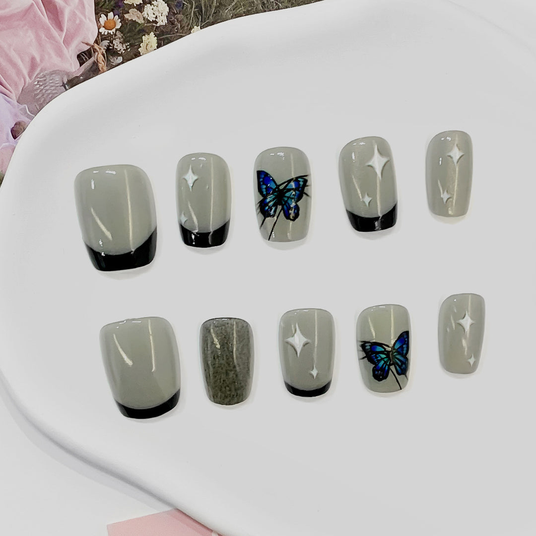 Artistic nail tips with butterfly designs Stornfield