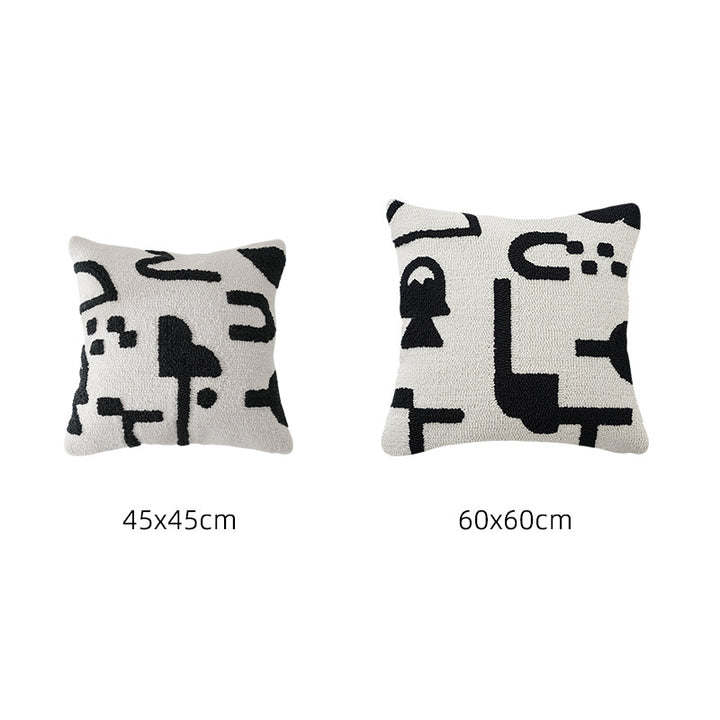 Hand-tufted decorative cushion with abstract graphic design and textured cotton surface