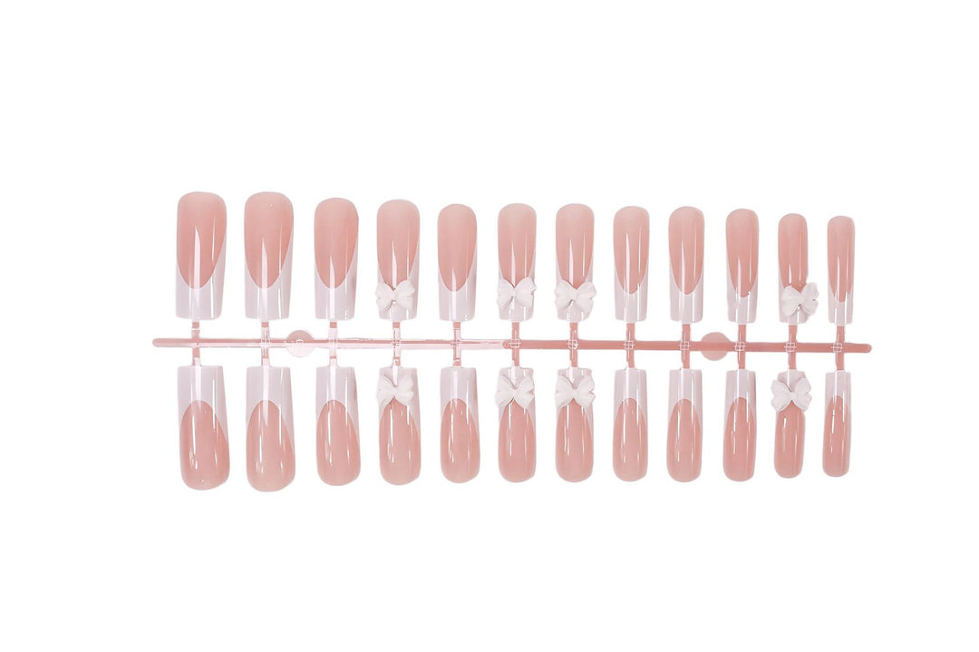 Artificial nail set with shimmering details and cute bows Stornfield
