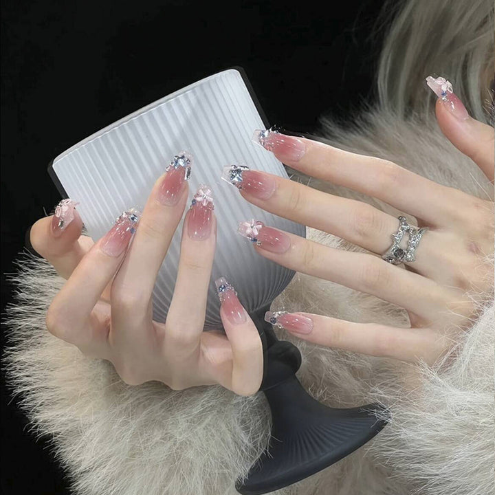 Artificial nail set with glamorous 3D decorations and shimmering accents Stornfield