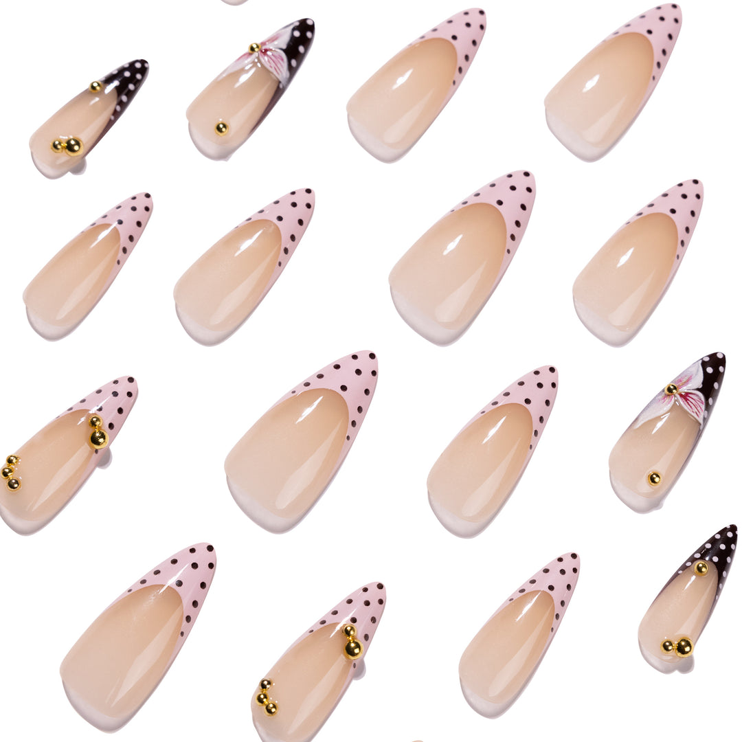 Artful stiletto nails with floral accents and glitter Stornfield