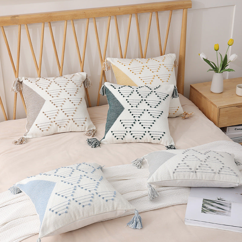Decorative woven cushion cover with geometric tuft-relief and tassels Stornfield