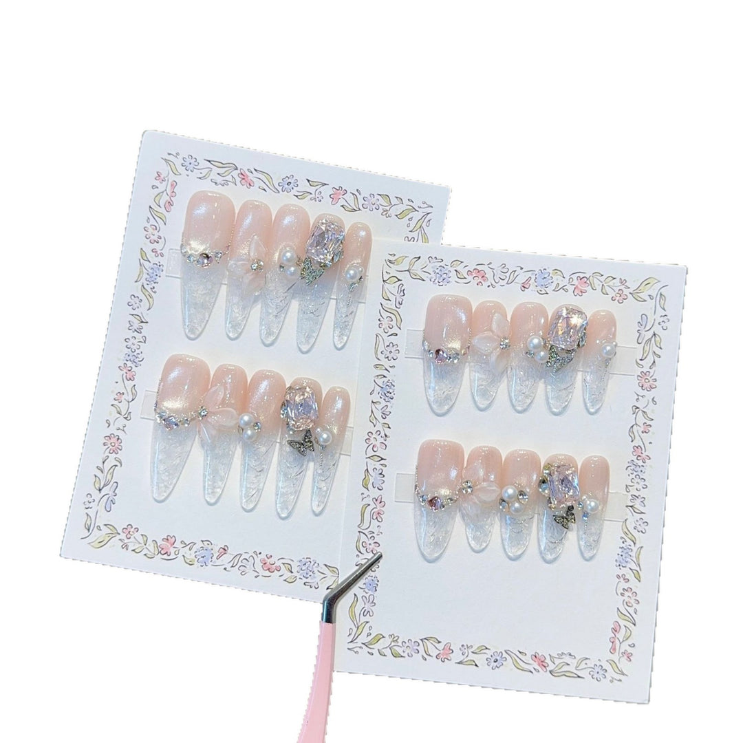 Artificial nails with delicate glitter and pearl decoration Stornfield
