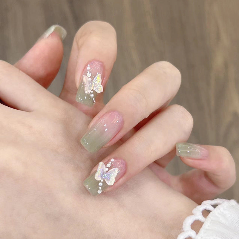 Stylish art false nails with heart design and glitter Stornfield