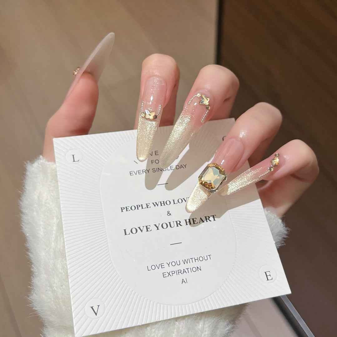 Artistic Stiletto Press-On Nail Art with Glimmering Accents Stornfield