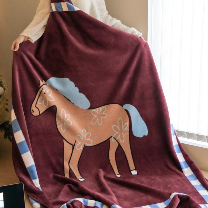 Children's cuddly blanket made of soft fleece with horse print and decorative edge