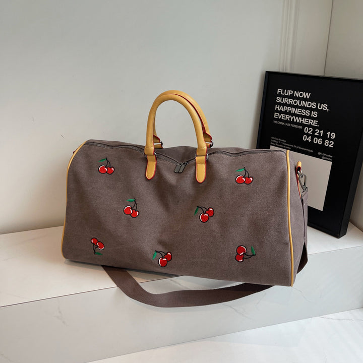 Sporty weekend bag with playful cherry pattern Stornfield