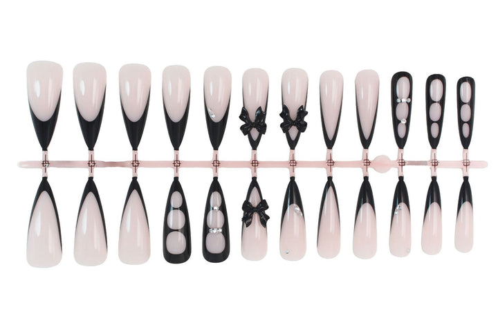 Acrylic nail set with shimmering accents and elegant bows Stornfield