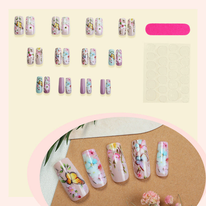 Artificial nail set with floral motifs and butterfly design Stornfield