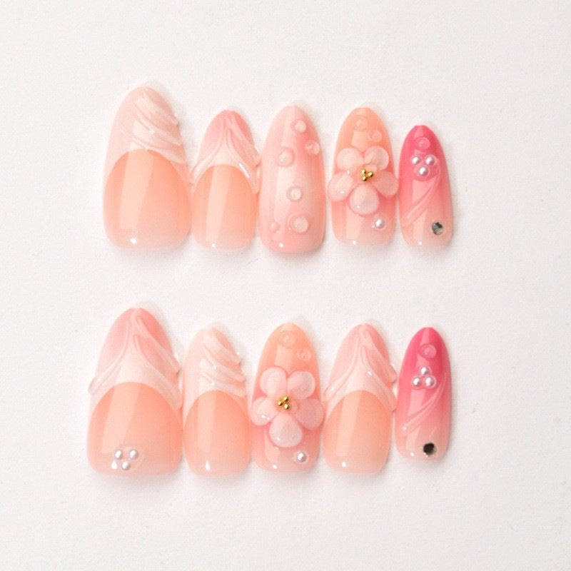 Artificial nail set with delicate floral and glitter accents Stornfield