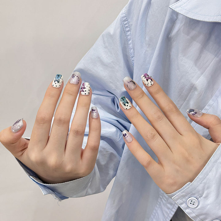Artistic Press-On Nail Art Set with Unique Whimsical Designs