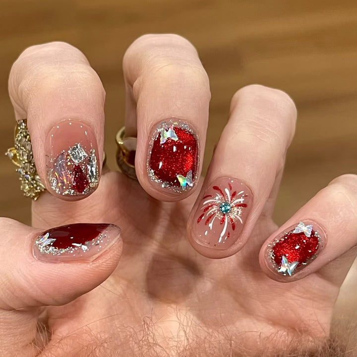 Artificial nail set with festive gift design and elegant glitter accents Stornfield