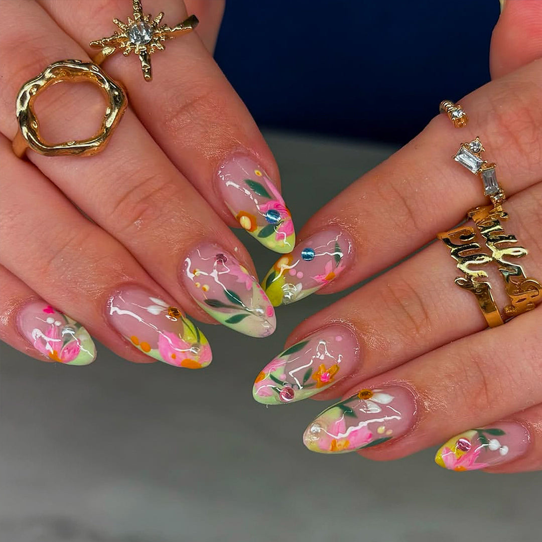 Artificial nails with flower design and glitter accents Stornfield