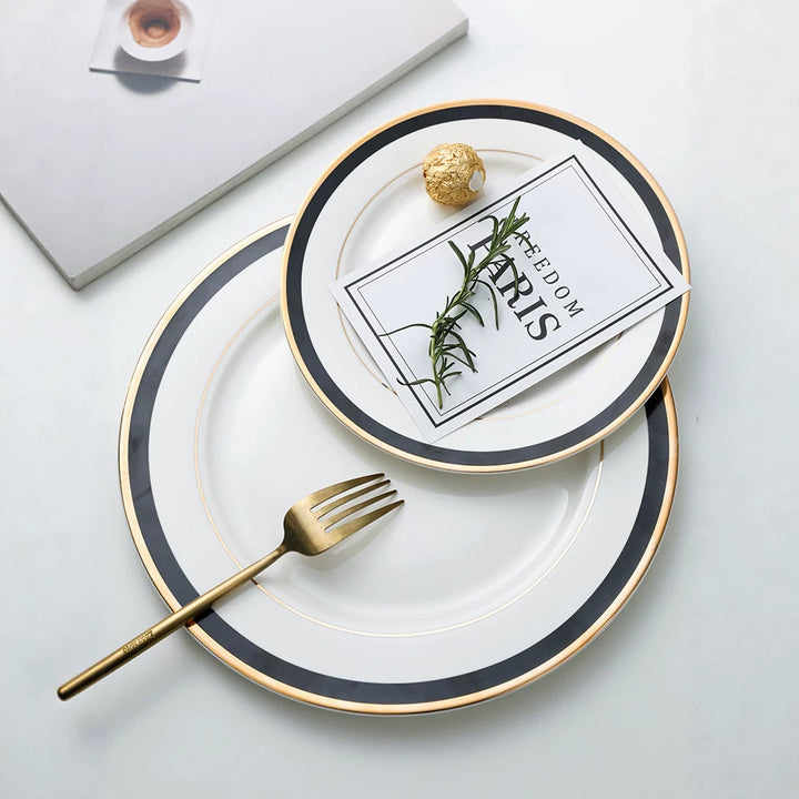 Porcelain plate with fine metal rim decoration and contrasting decorative ribbon