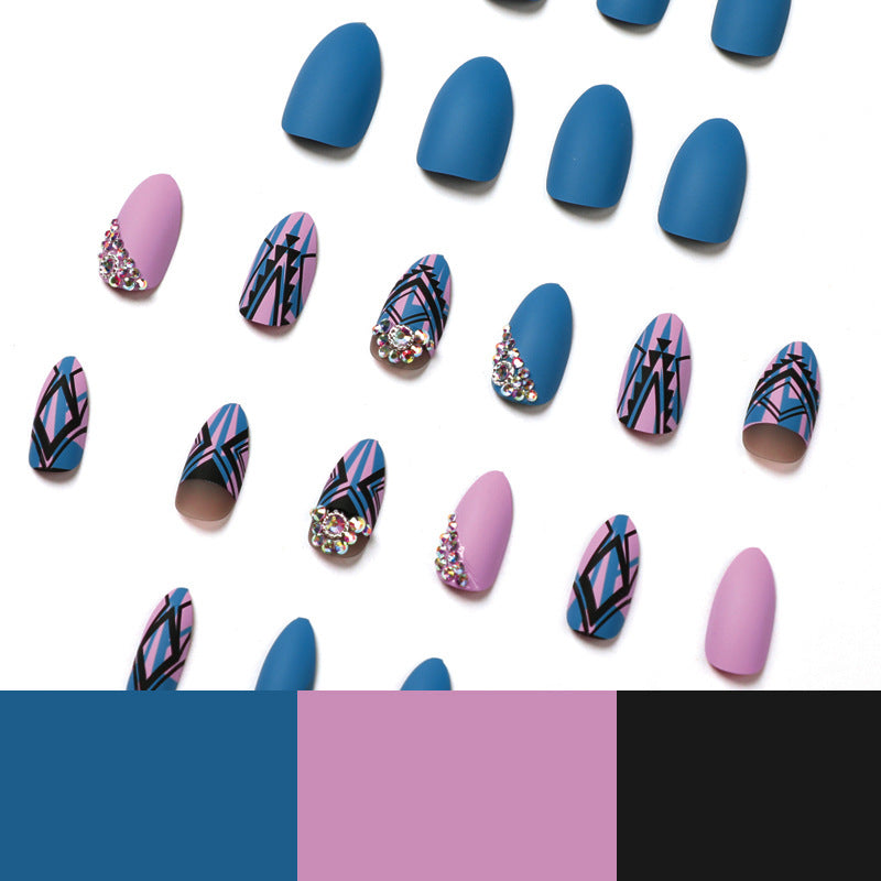 Artful stiletto nails with modern geometric designs and rhinestone embellishments Stornfield