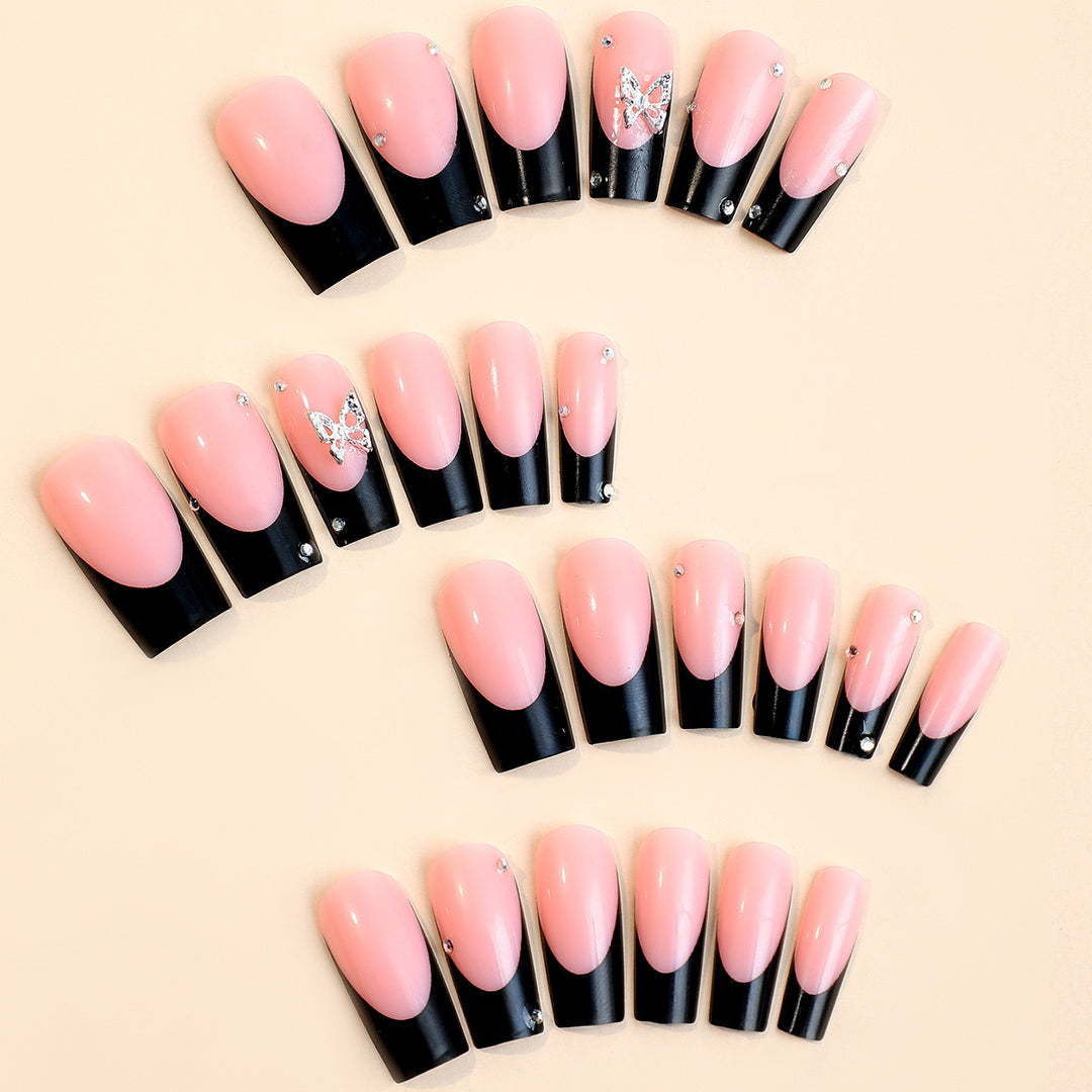 Acrylic nail set with elegant rhinestone details and modern designs Stornfield