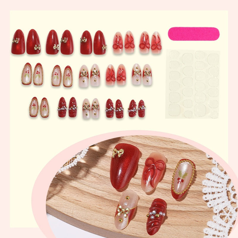 Artificial nail set with glamorous decorations and festive accents Stornfield