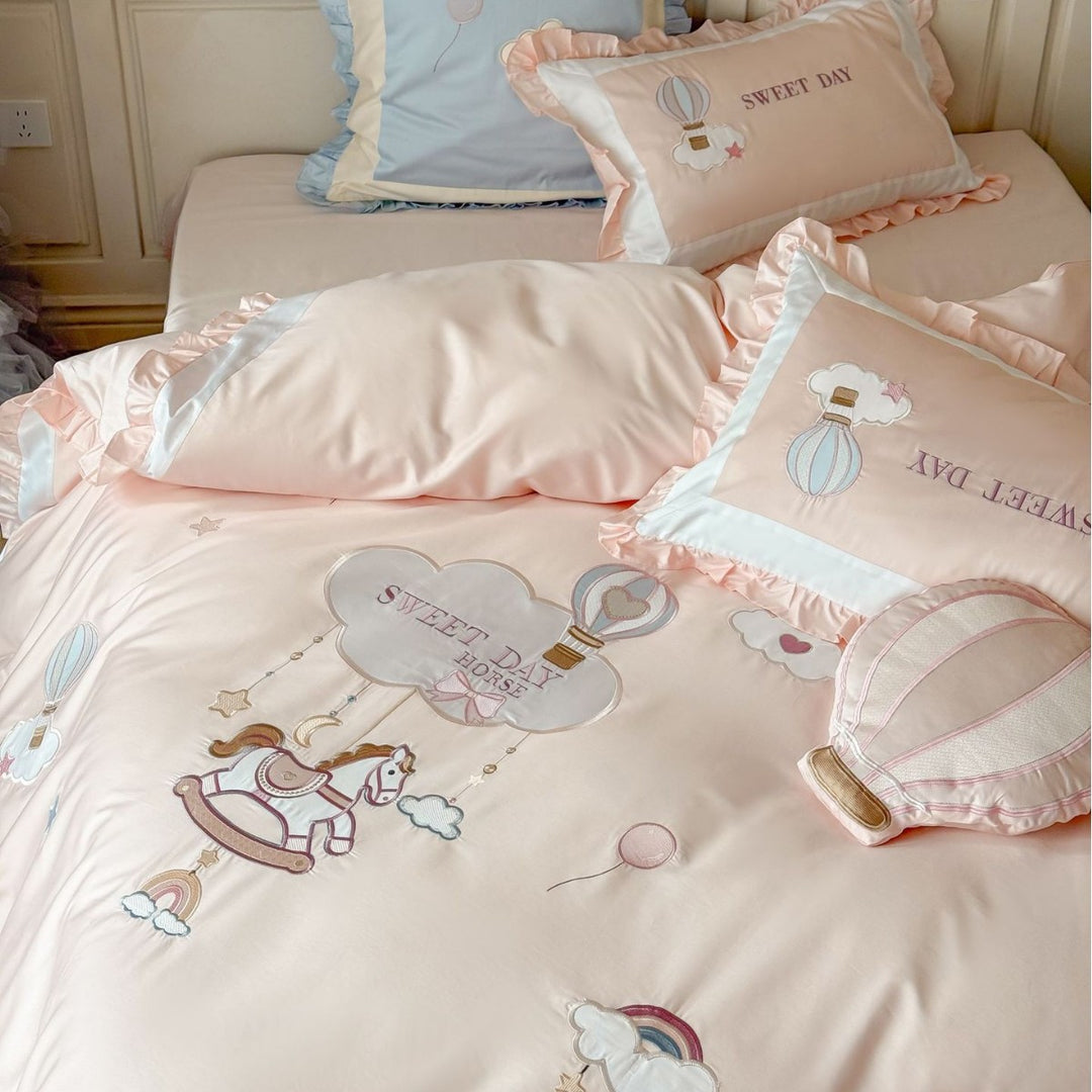 Bedding set in vintage girl style with ruffled hem, hot air balloon applique, and extra soft satin
