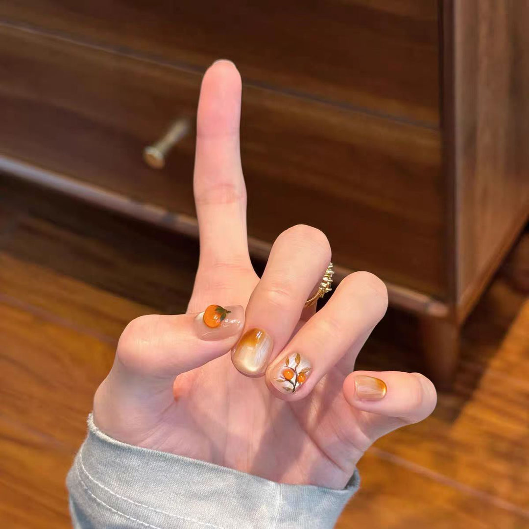 Artificial nails with elegant ombre effect and floral accents Stornfield