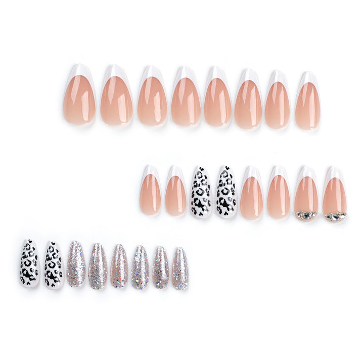 Artful stiletto nails with leopard patterns and glitter accents Stornfield